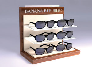 Banana Republic ® counter display high-end luxury counter eyewear display that shows the iconic brands licensed eyewear collection. Laminated MDF with woodgrain