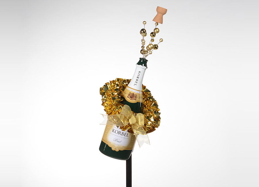 . Korbel® pole topper program looks just like a bottle of champagne complete with cork coming out of the top. This spins on the base